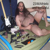 Fat hairy man in a speedo with guns and Guitar Hero controllers Fat hairy man in a speedo with guns and Guitar Hero controllers