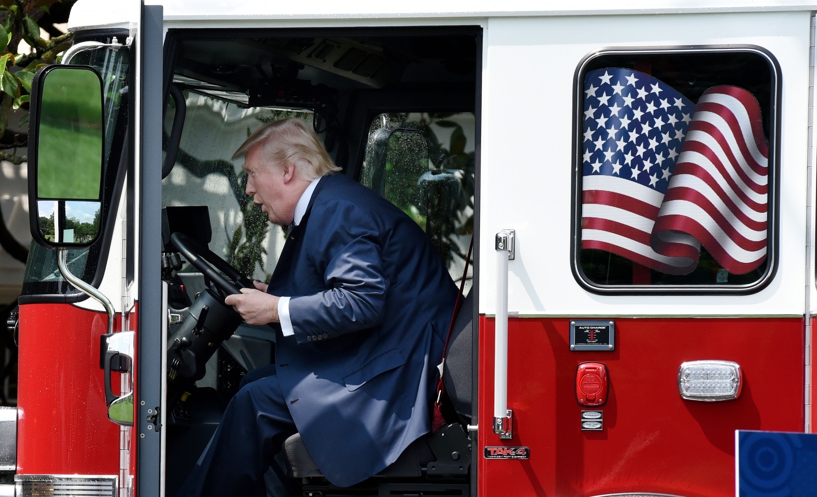 President Plays In Big Red Firetruck