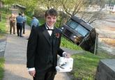 The guy holding a sewing machine, in front of a UPS Truck Accident (the unexplainable picture)